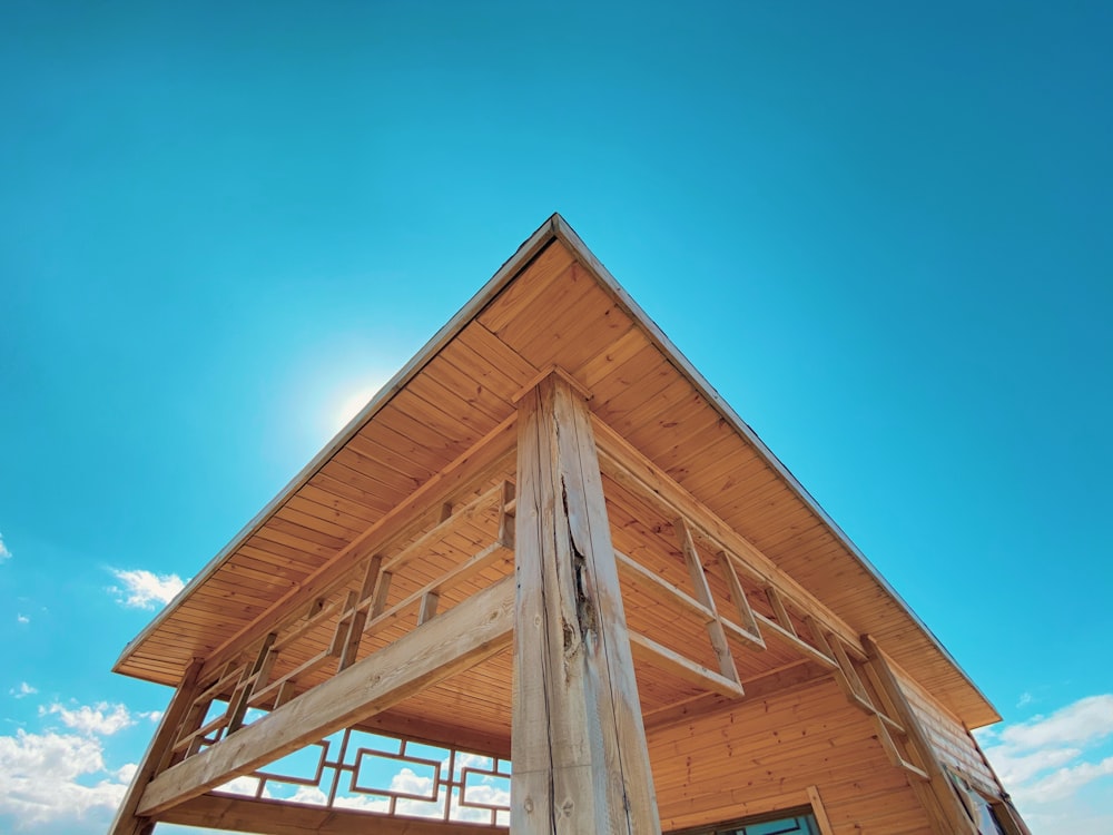 brown wooden house under blue sky during daytime