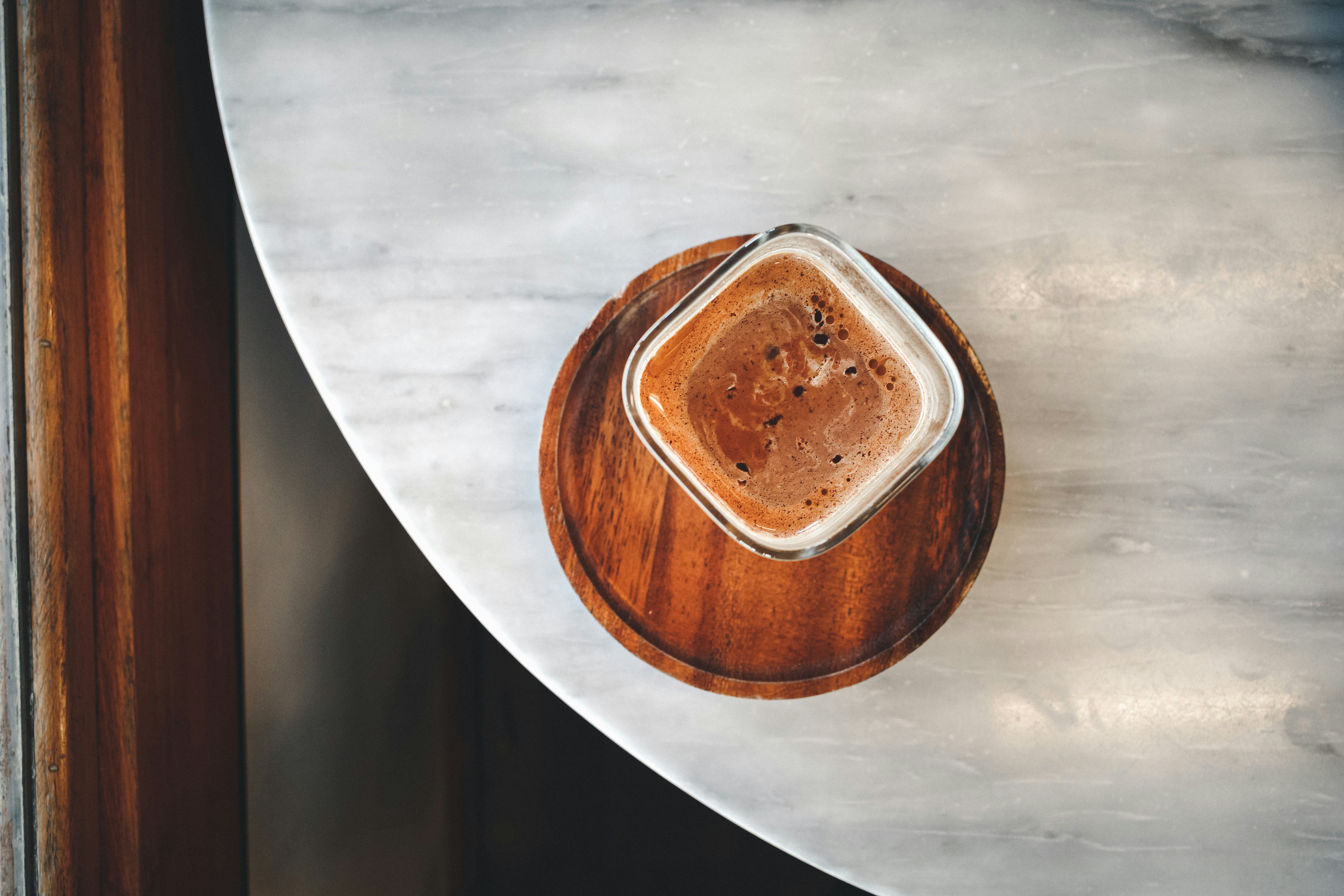Coffee on a wooden tray on marble