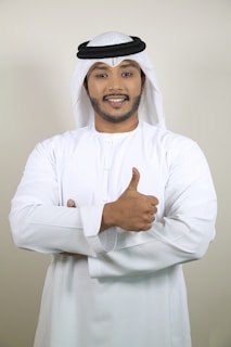 Smiling movers giving thumbs up after completing a successful move in Dubai