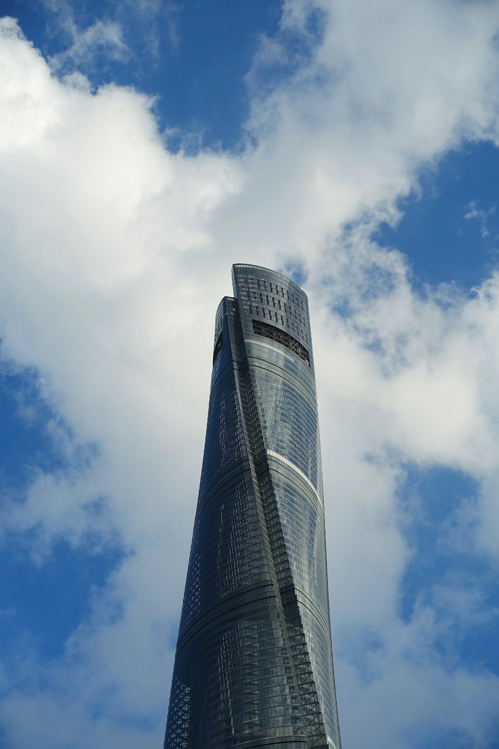 low angle photography of high rise building under blue sky during daytime