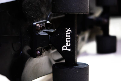 Detail shot of polished trucks and fresh wheels on a trendy mini-cruiser deck