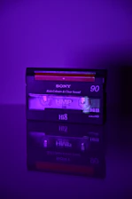 a purple cassette player sitting on top of a table