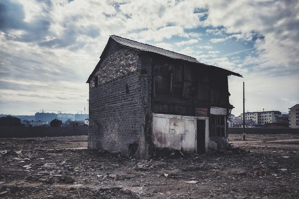 brown wooden house under white clouds during daytime