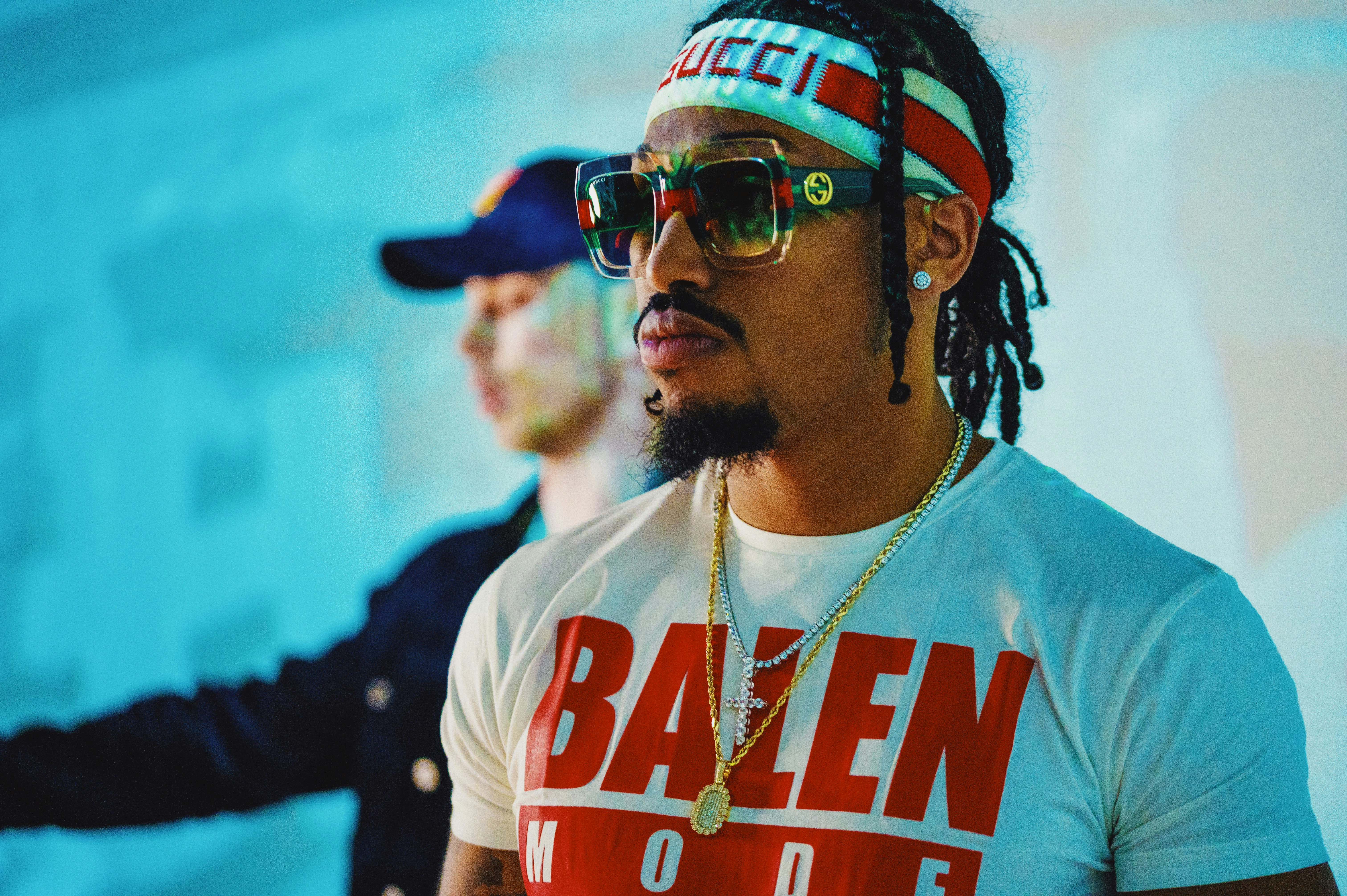 man in white crew neck t-shirt wearing sunglasses