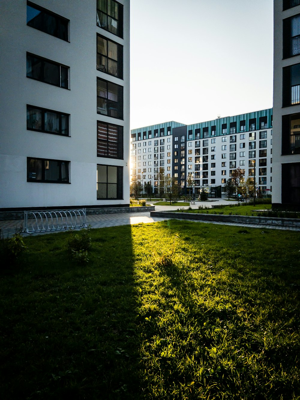 white concrete building near green grass field during daytime