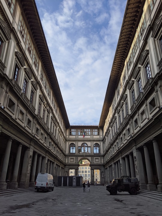 brown concrete building during daytime in Uffizi Gallery Italy