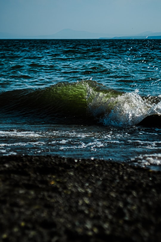 water waves on black rock in Sevan Armenia