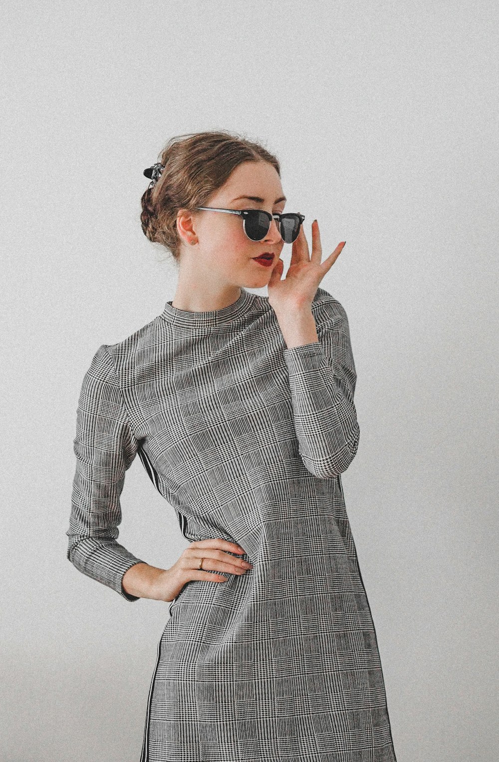woman in black and white long sleeve dress wearing black sunglasses