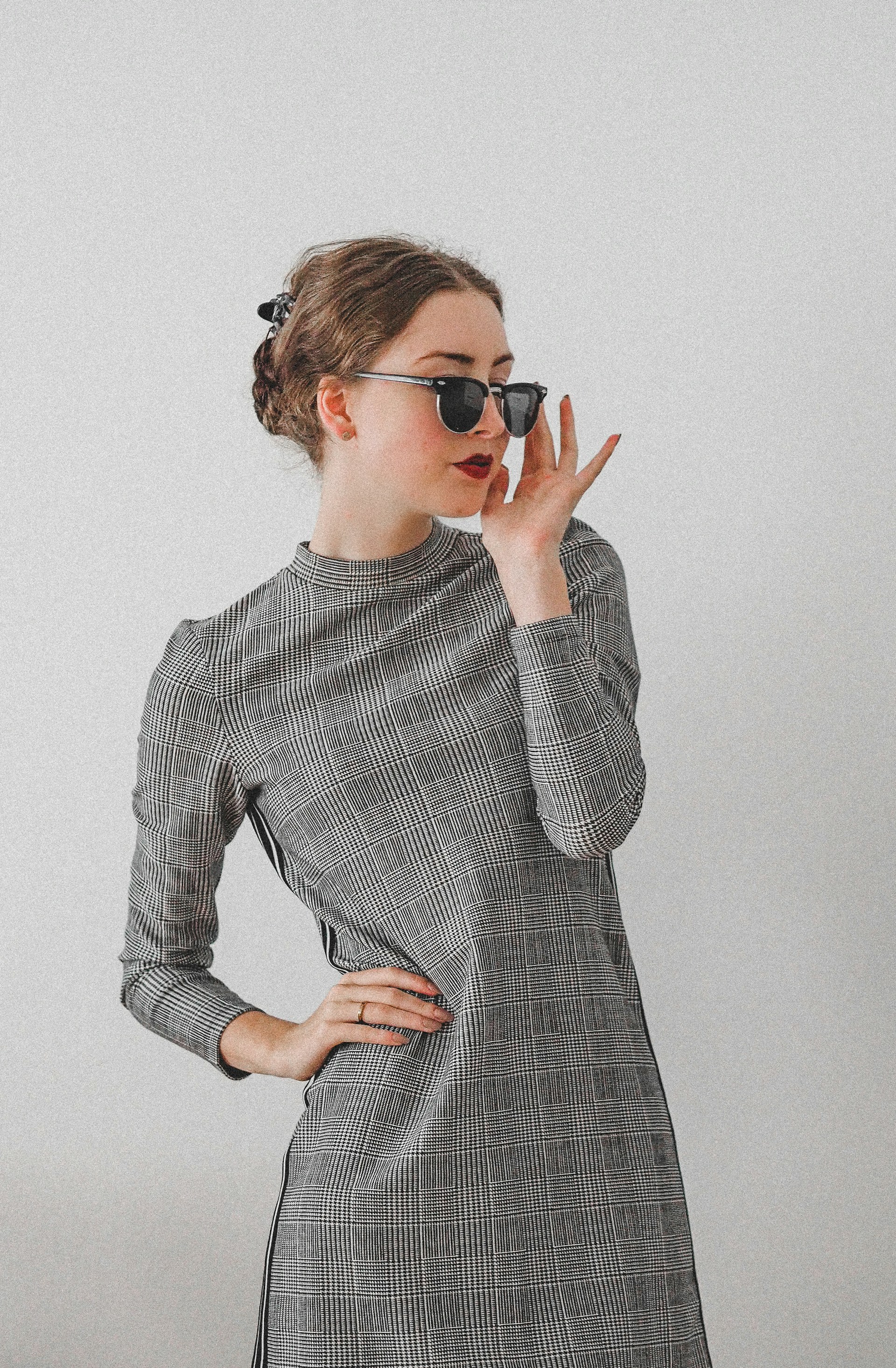 woman in black and white long sleeve dress wearing black sunglasses