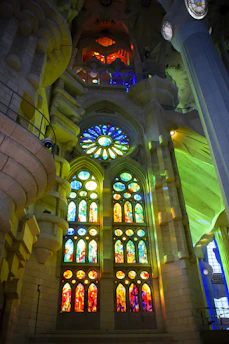 Elegant cathedral glass window with colorful patterns illuminated by natural light