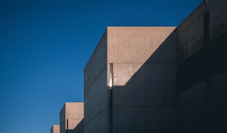Concrete driveway with decorative patterns and clean, sharp lines under a bright sky