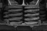 black metal tool in grayscale photography