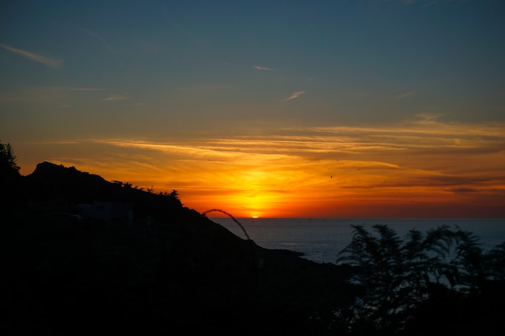 silhouette of mountain during sunset