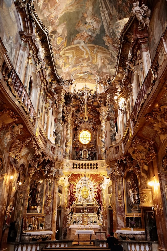 gold and white cathedral interior in Asamkirche Germany