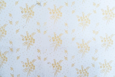 white and brown floral textile