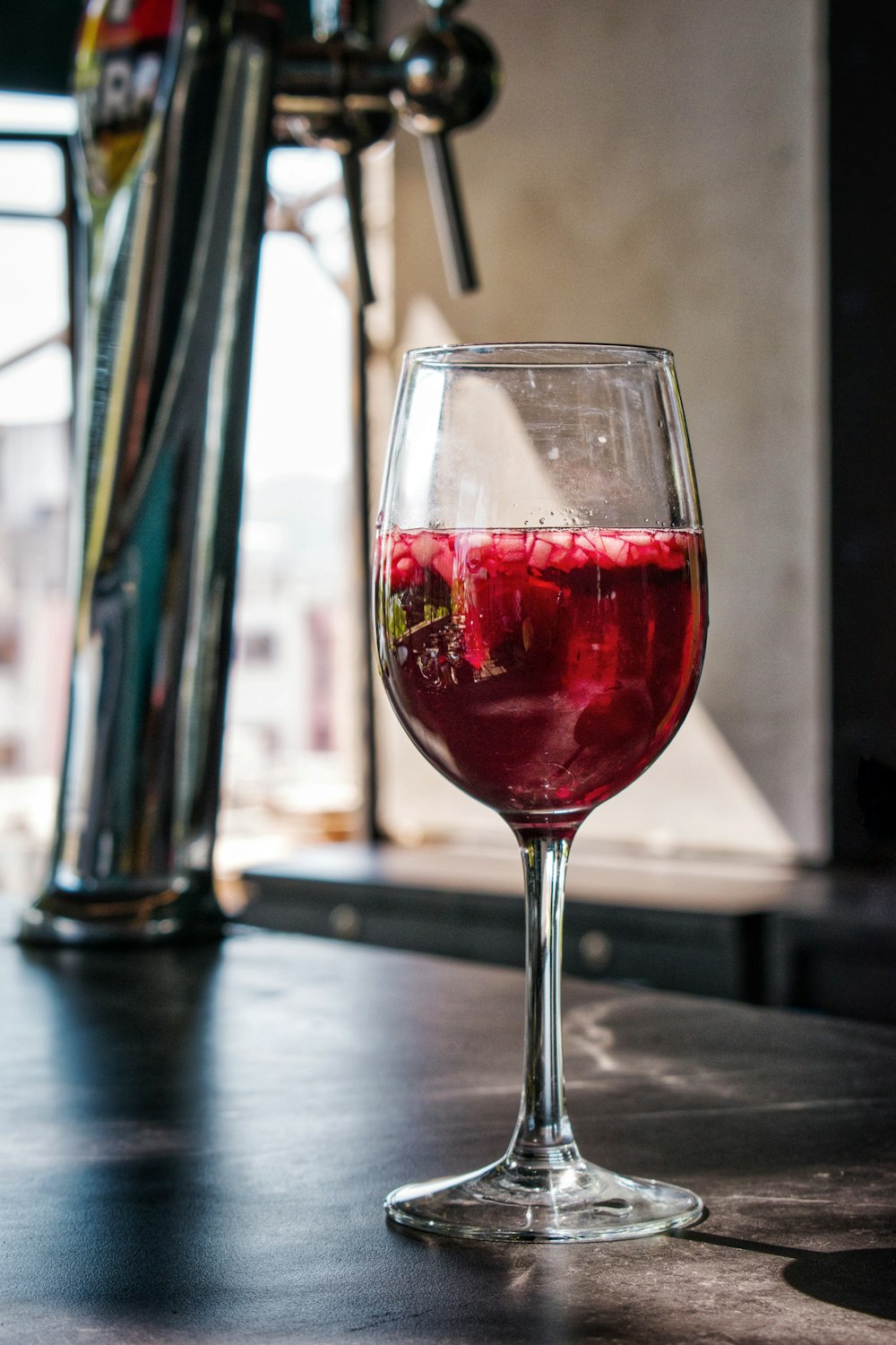 red wine in clear wine glass on table