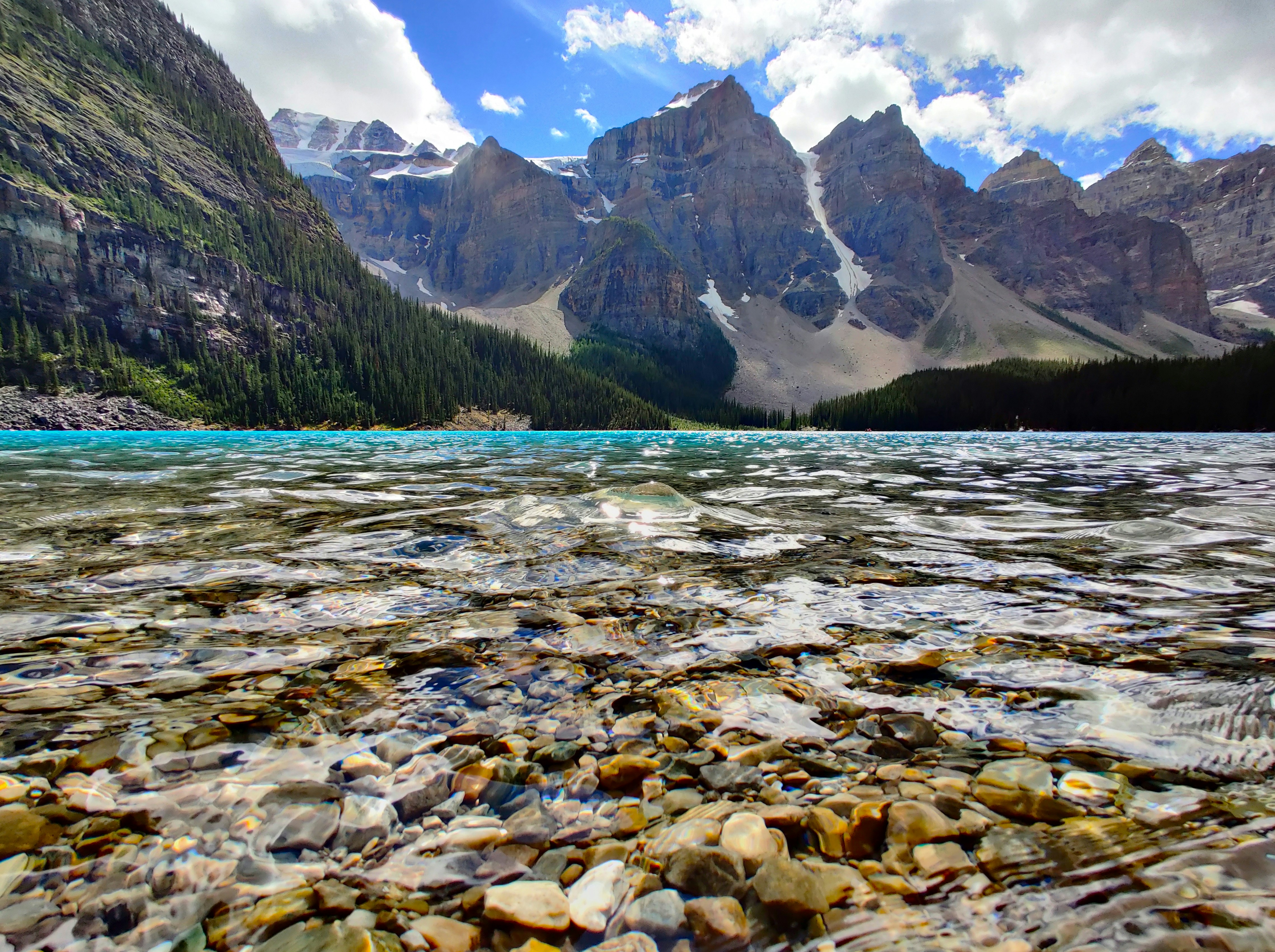 Brown and green mountains near body of water during daytime photo ...