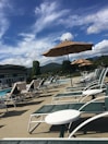 A relaxing pool area with sun loungers.