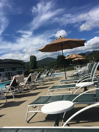 Inviting swimming pool area with sun loungers and a separate baby pool.