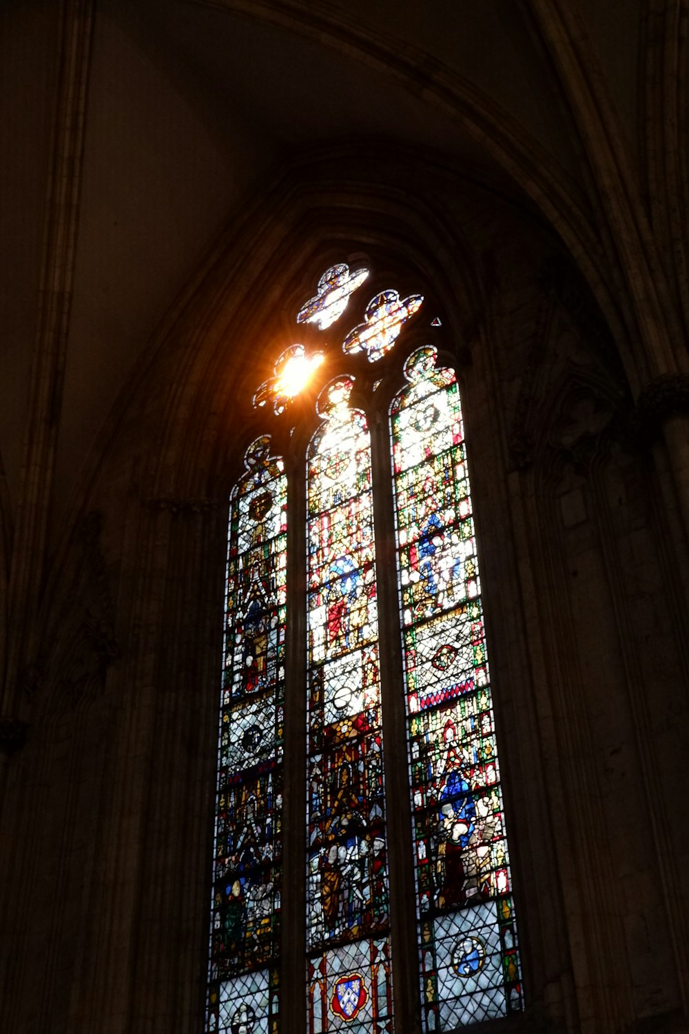 blue red and yellow glass window