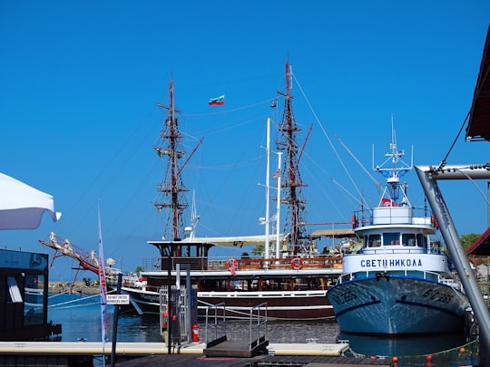 white and black ship on dock during daytime in Sozopol Bulgaria