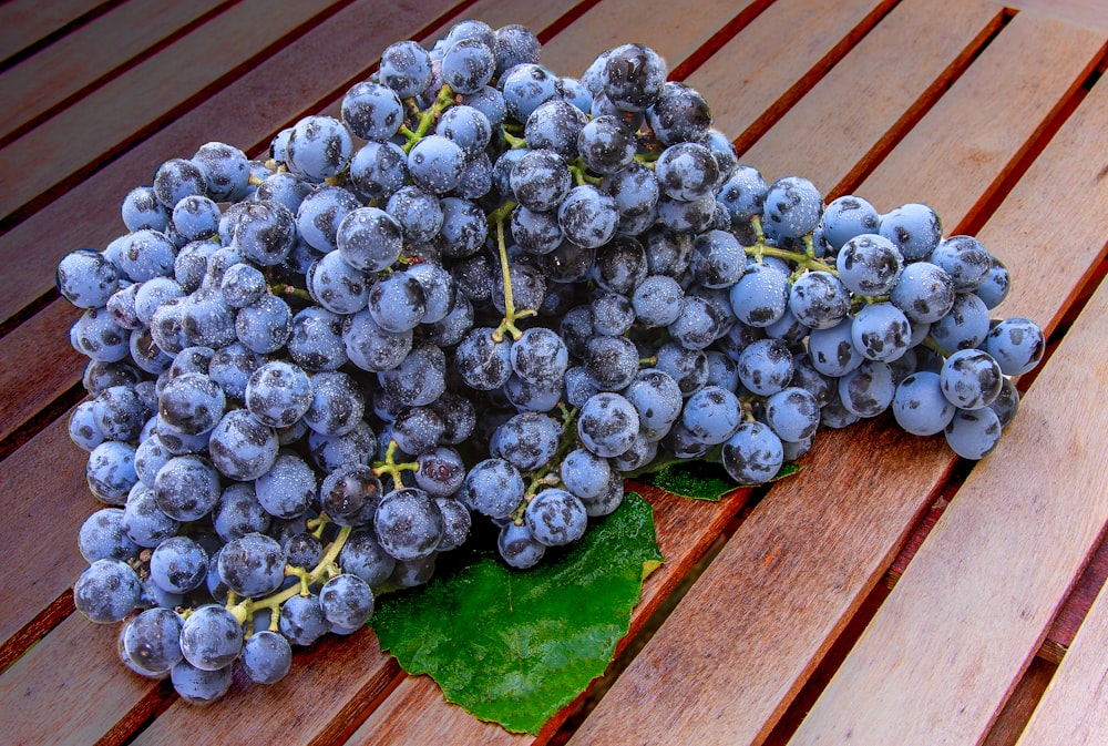 blue berries on green wooden table