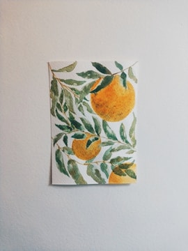Brightly painted canvas featuring a vibrant papaya fruit and leaves.
