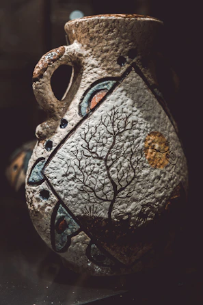 A serene ceramic vase with subtle brush strokes inspired by Zen art.