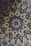 A beautifully engraved tile featuring intricate floral designs and patterns.