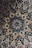 A beautifully engraved tile featuring intricate floral designs and patterns.