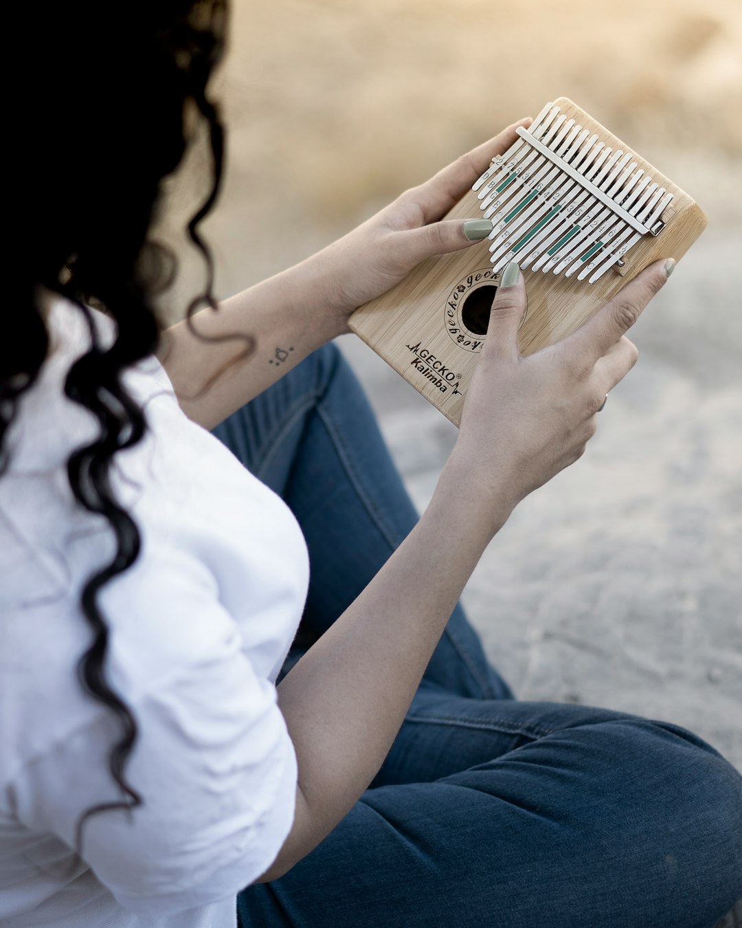 person in white shirt holding brown pack