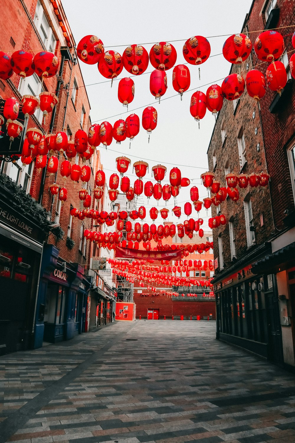 red paper lanterns on street during daytime