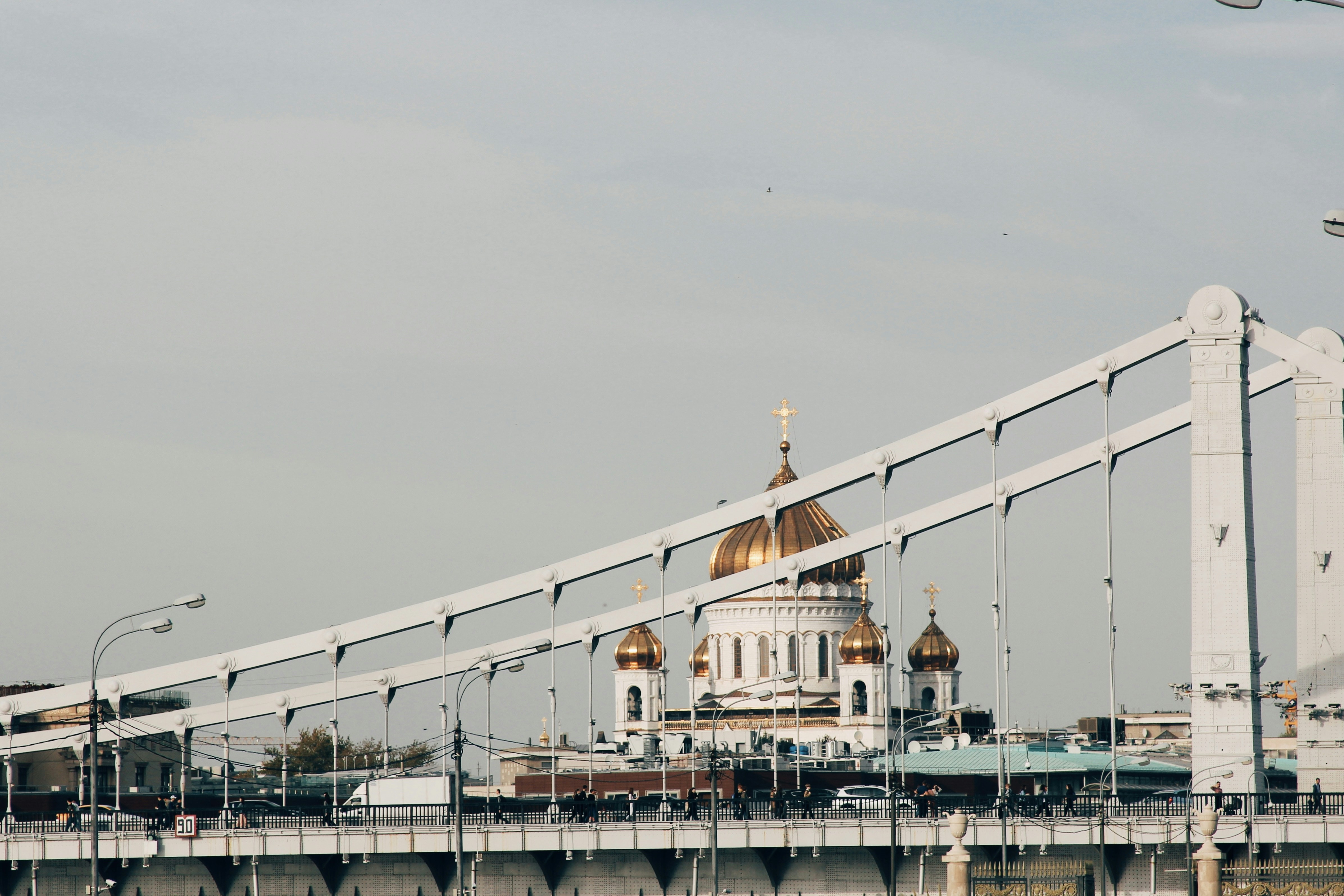 white and brown bridge over body of water during daytime