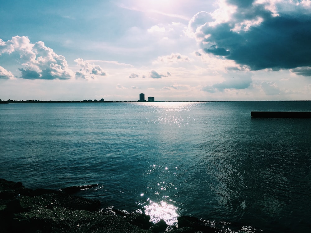 body of water under blue sky during daytime