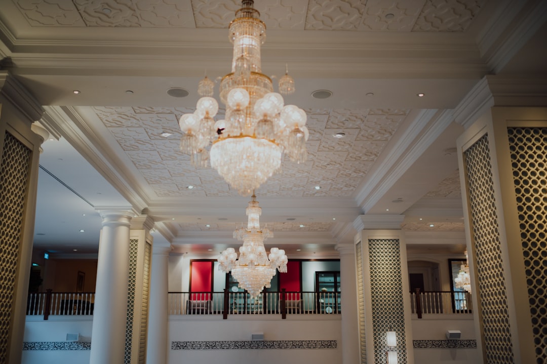 gold and white uplight chandelier