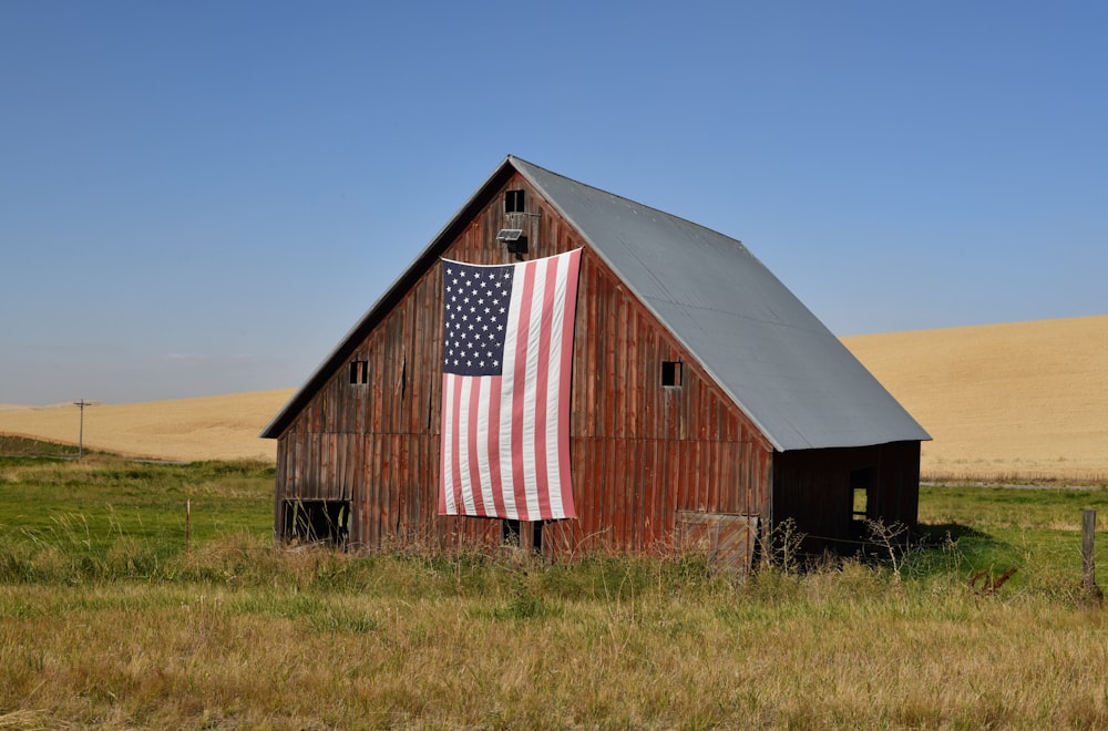 red and white barn house under blue sky during daytime