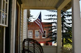 Veterans sharing a quiet moment on the post’s porch overlooking the Florida coastline.