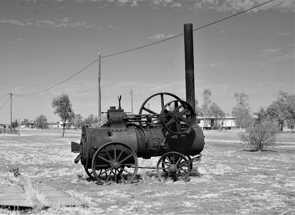 grayscale photo of black train on field