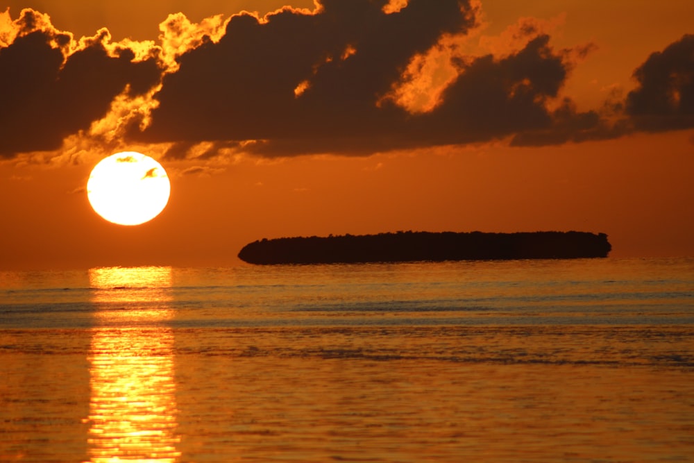 body of water during sunset