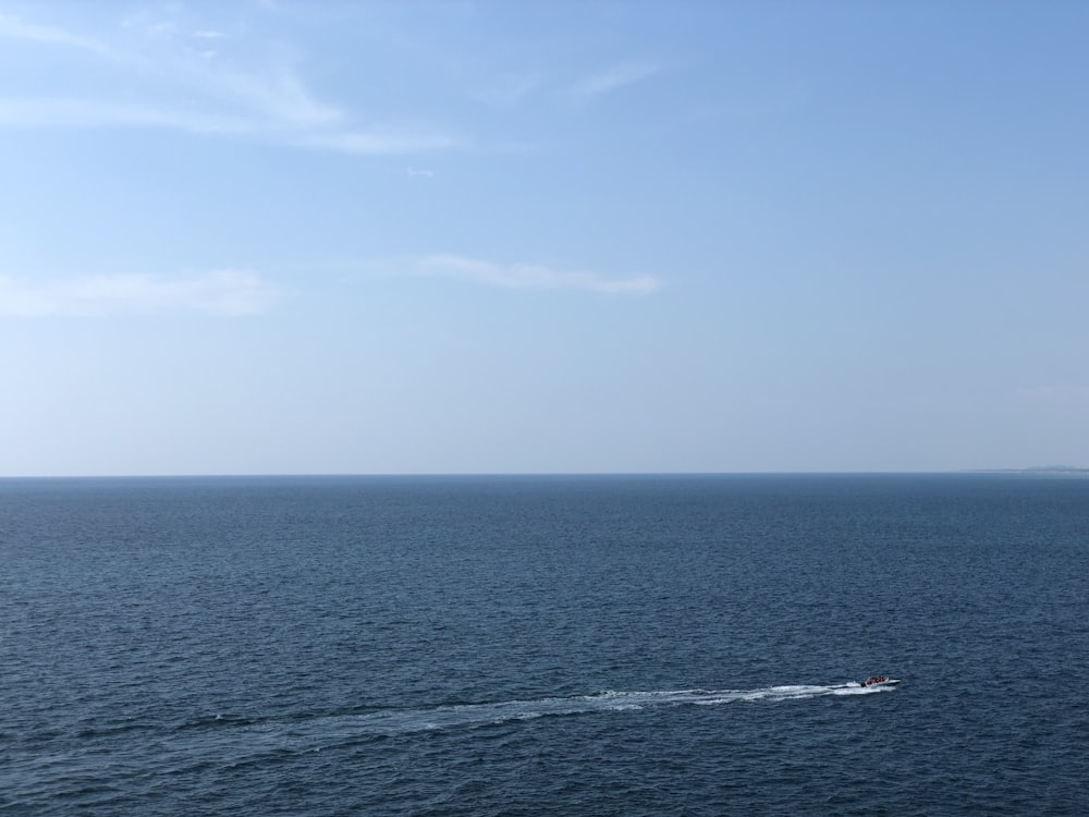 body of water under blue sky during daytime