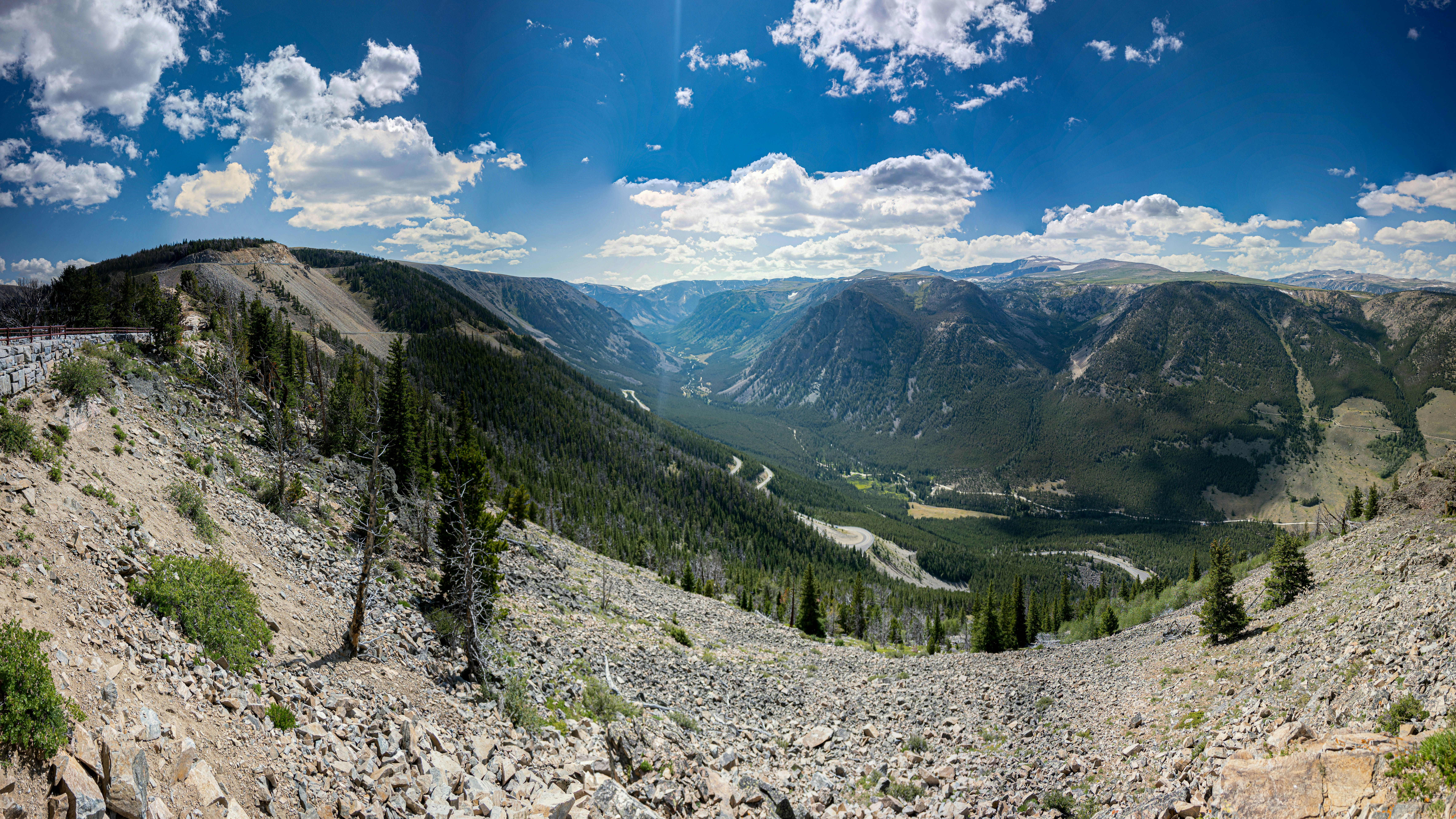 green trees on mountain under blue sky during daytime
