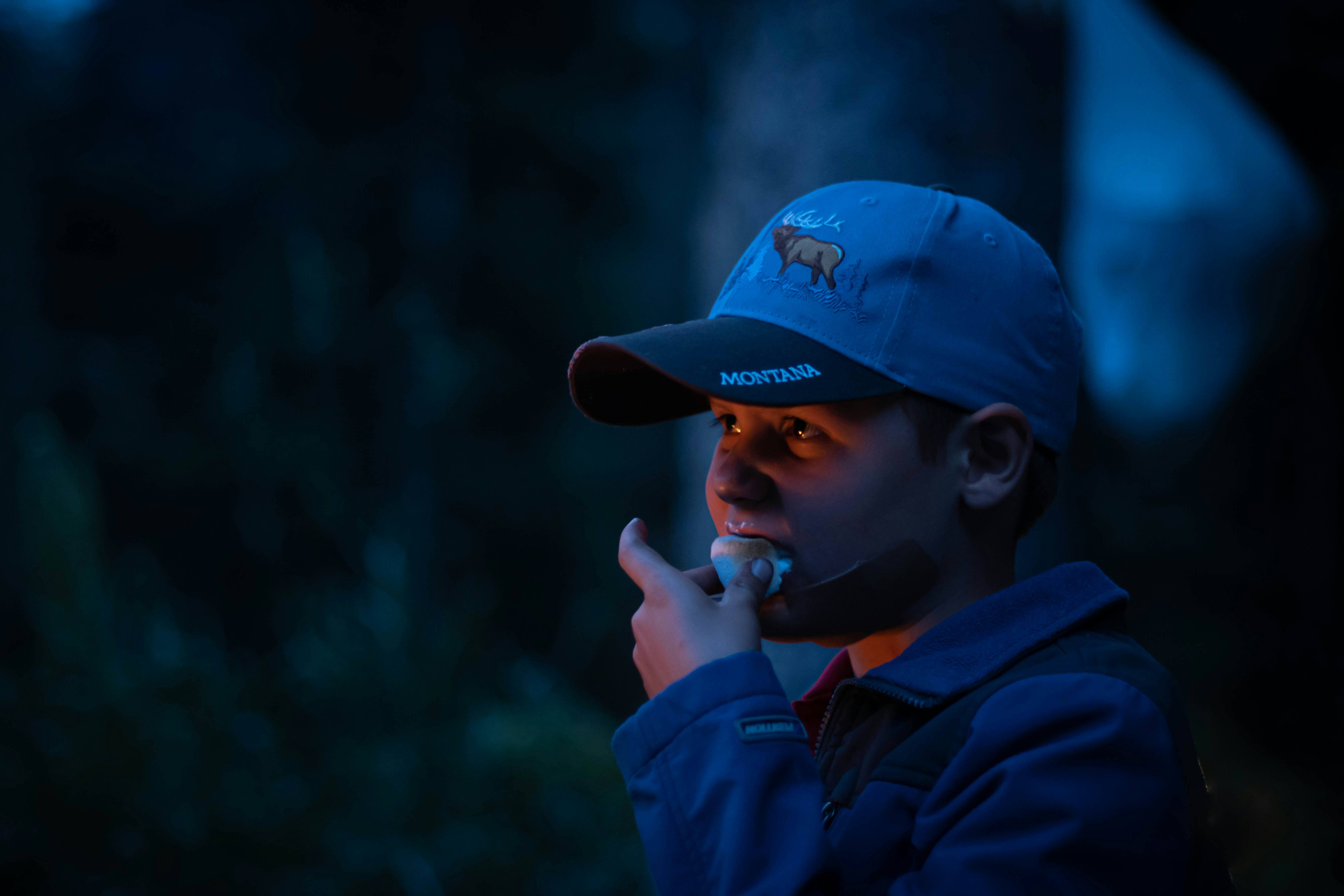 man in blue and red cap and blue jacket