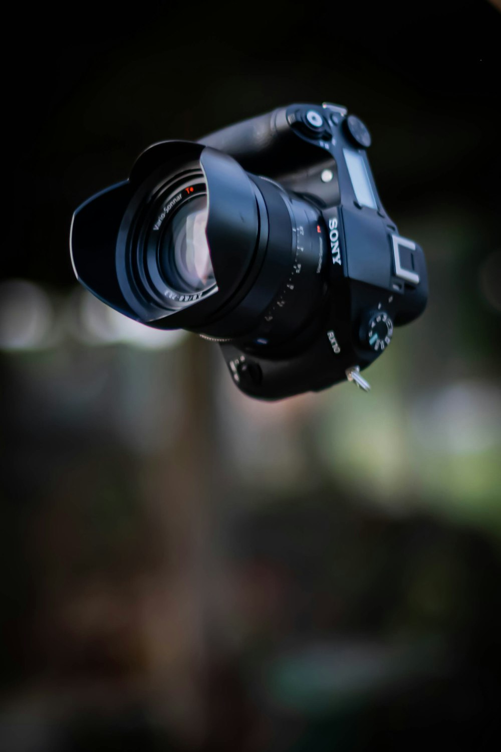 black nikon dslr camera in tilt shift lens