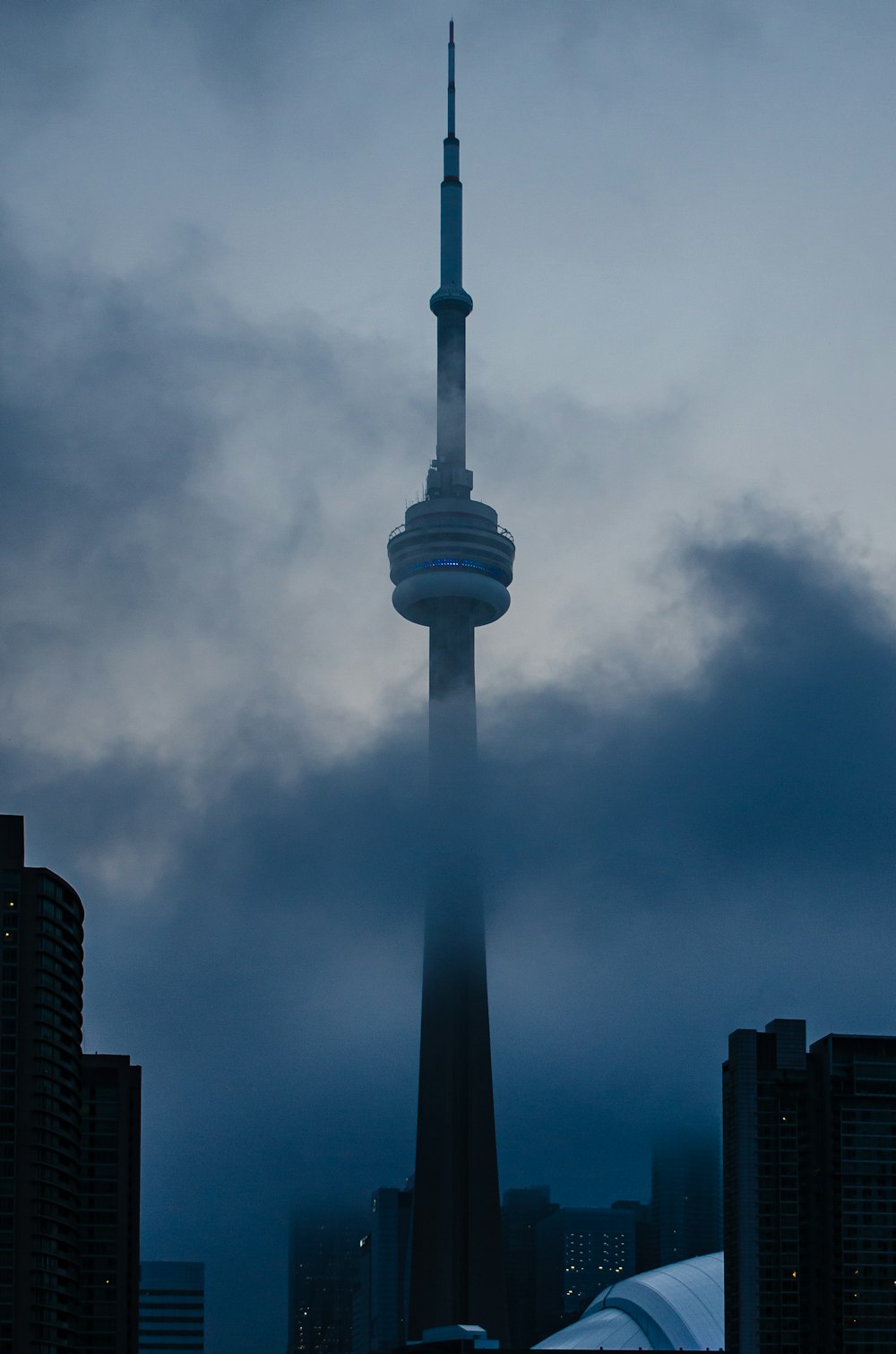 white tower under cloudy sky