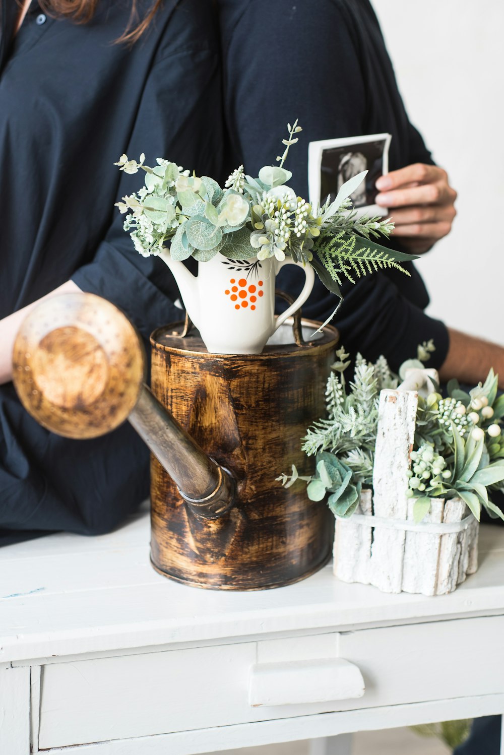 white flowers in brown wooden vase