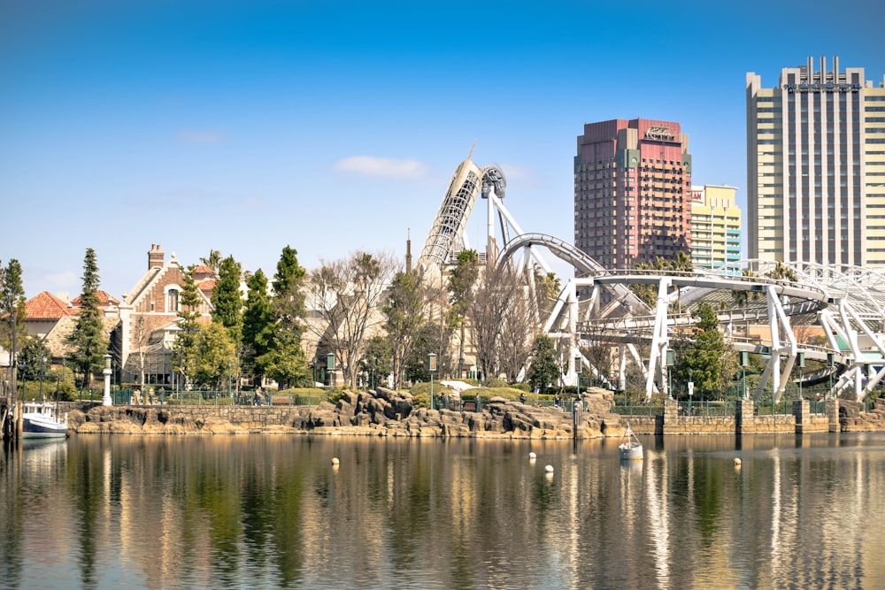 white and brown concrete building near body of water during daytime