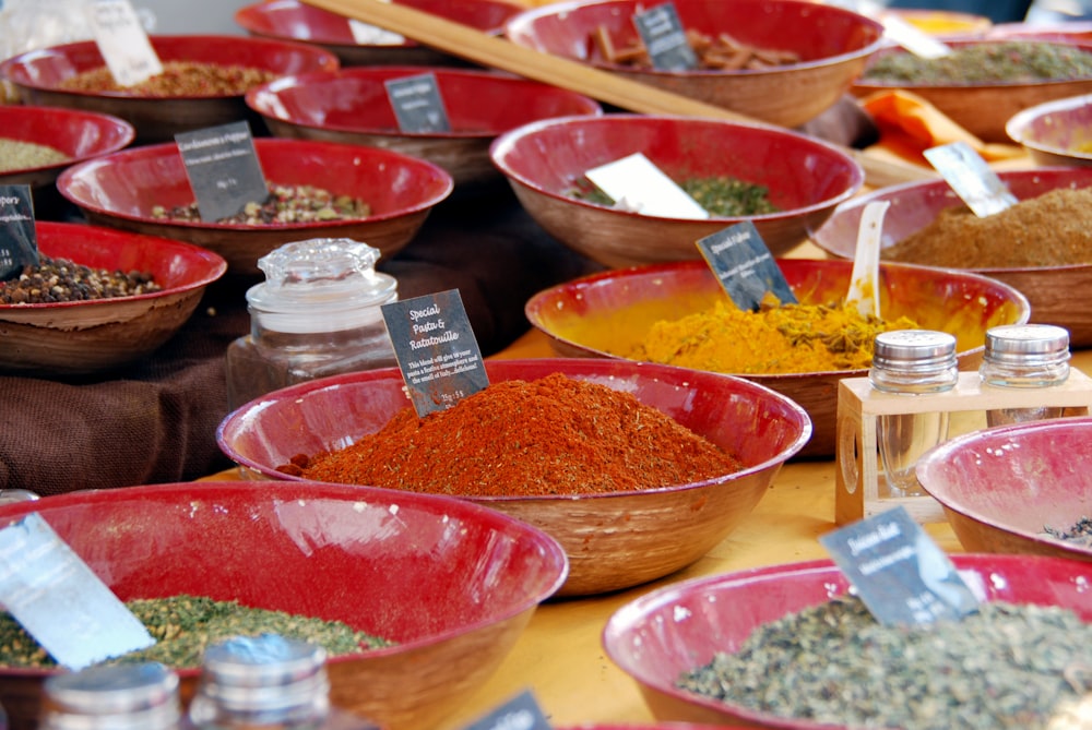 red plastic bowls on brown wooden table