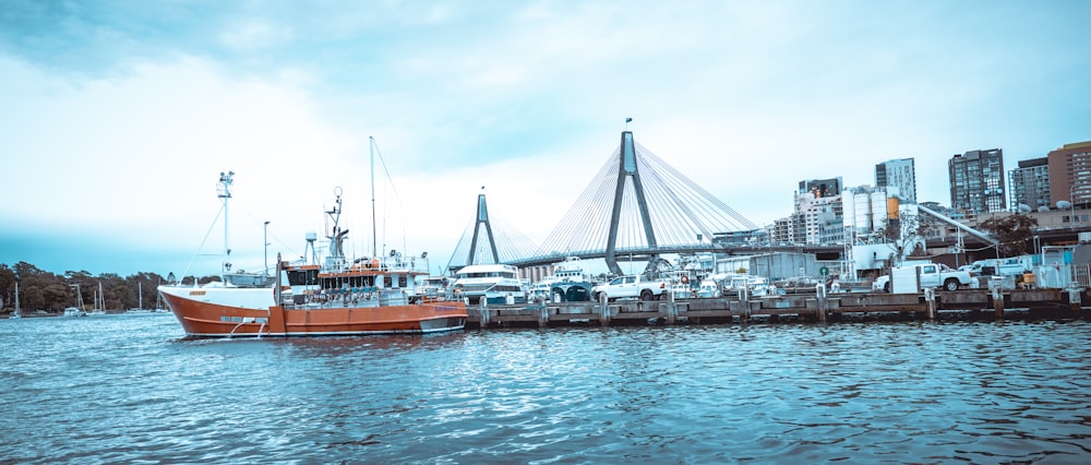 white and brown boat on dock during daytime