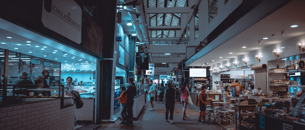 people walking on street during nighttime