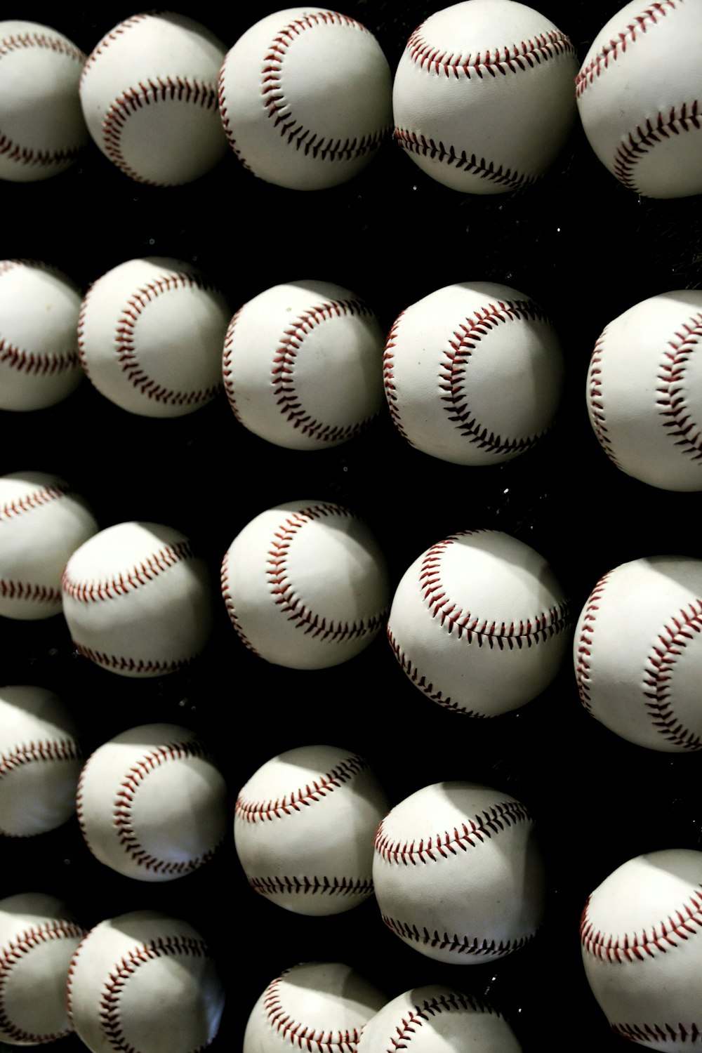 white and red baseball ball